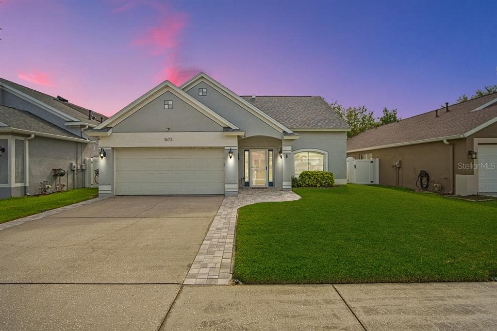 1673 MEADOW OAK LANE TARPON SPRINGS, FL 34689