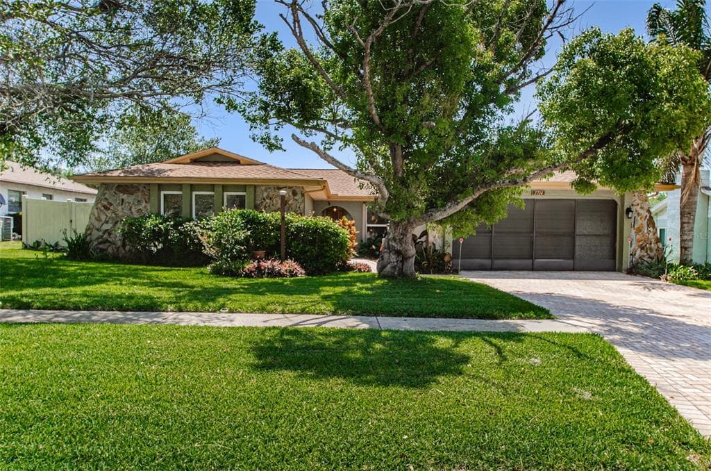 7714 LAKESIDE WOODLANDS DRIVE HUDSON, FL 34667