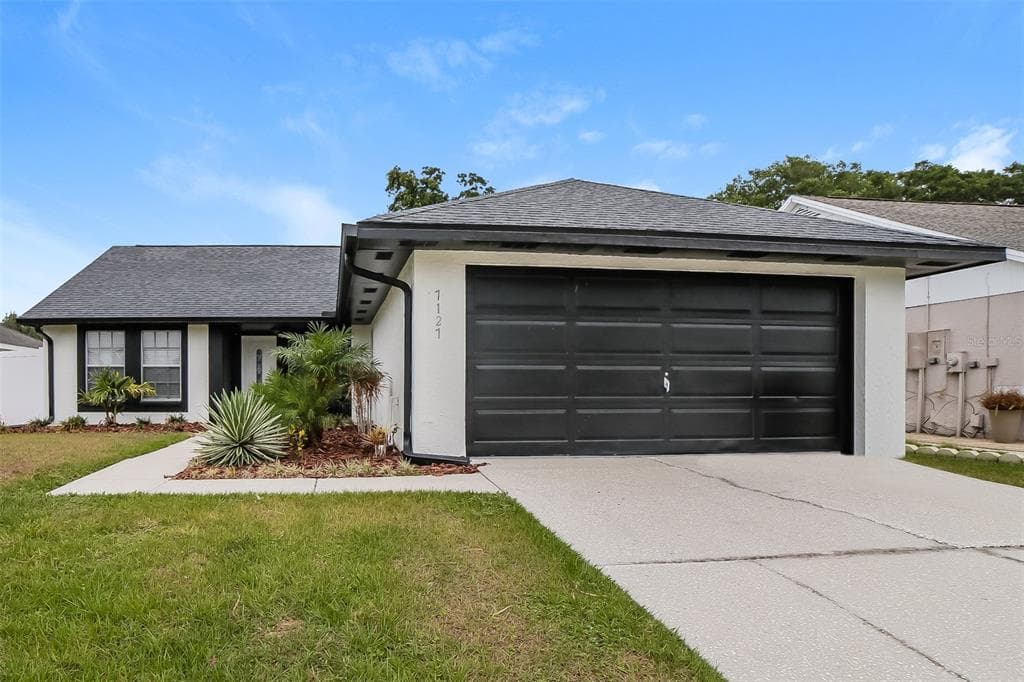 7127 HOLLOWELL DRIVE TAMPA, FL 33634