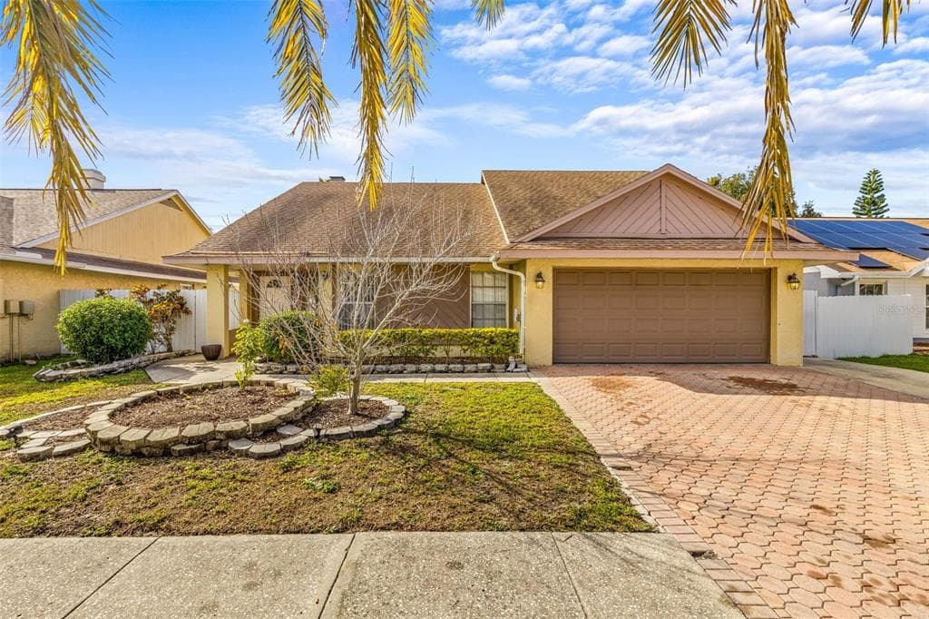 7052 HOLLOWELL DRIVE TAMPA, FL 33634