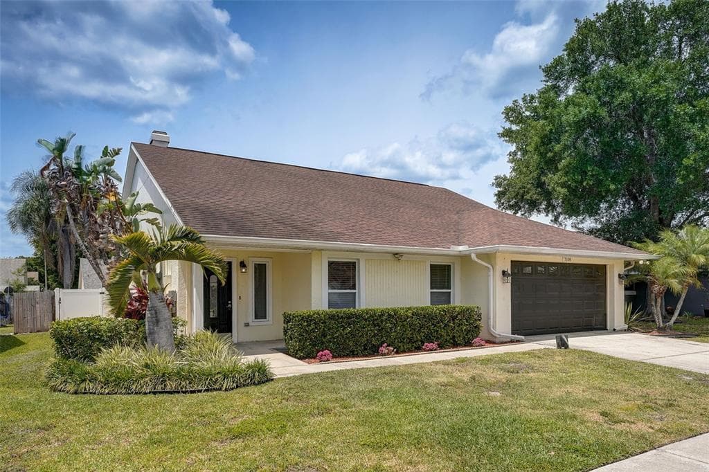 7108 HOLLOWELL DRIVE TAMPA, FL 33634
