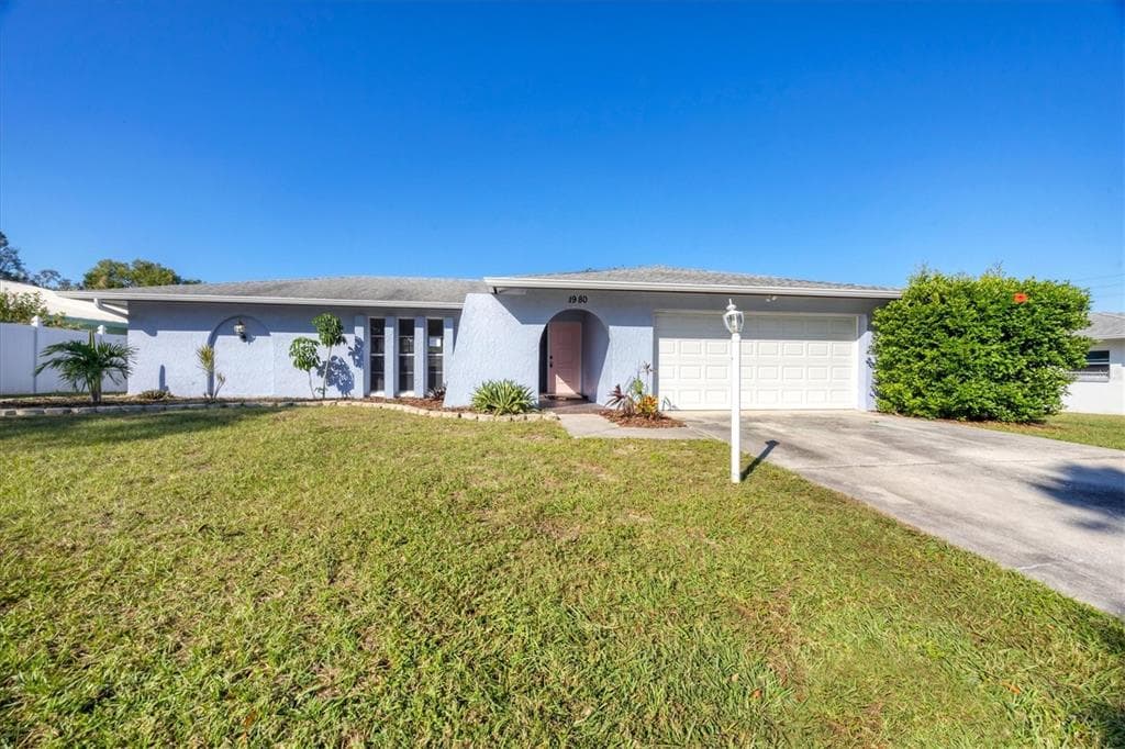 1980 CANADIANA COURT DUNEDIN, FL 34698