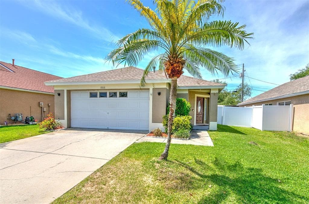 1666 MEADOW OAK LANE TARPON SPRINGS, FL 34689