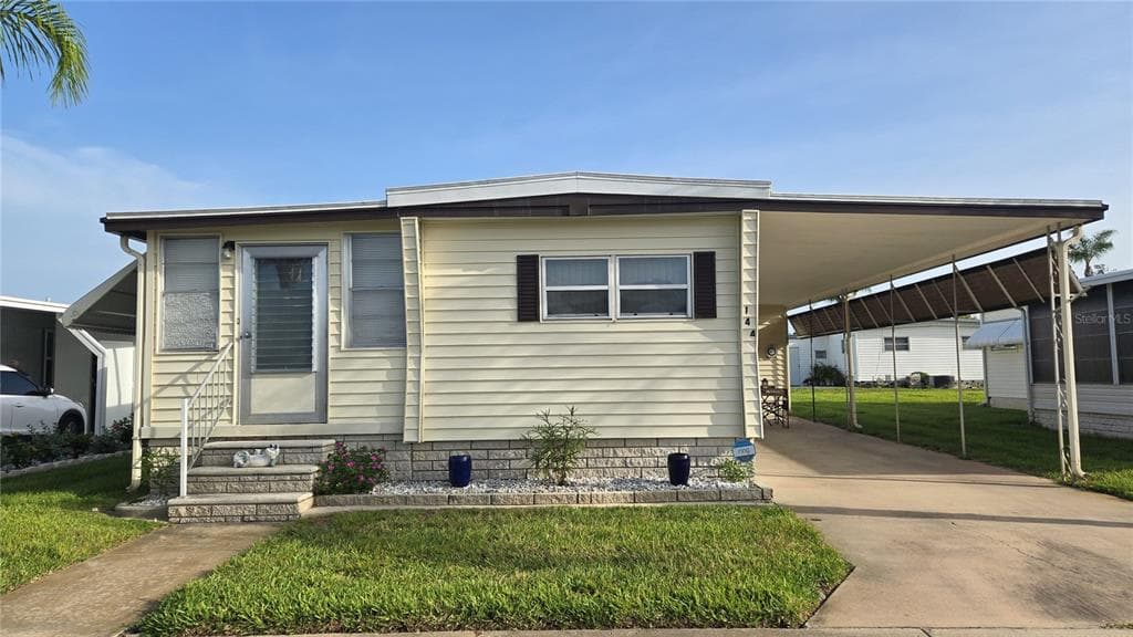 144 MELODY LANE TARPON SPRINGS, FL 34689