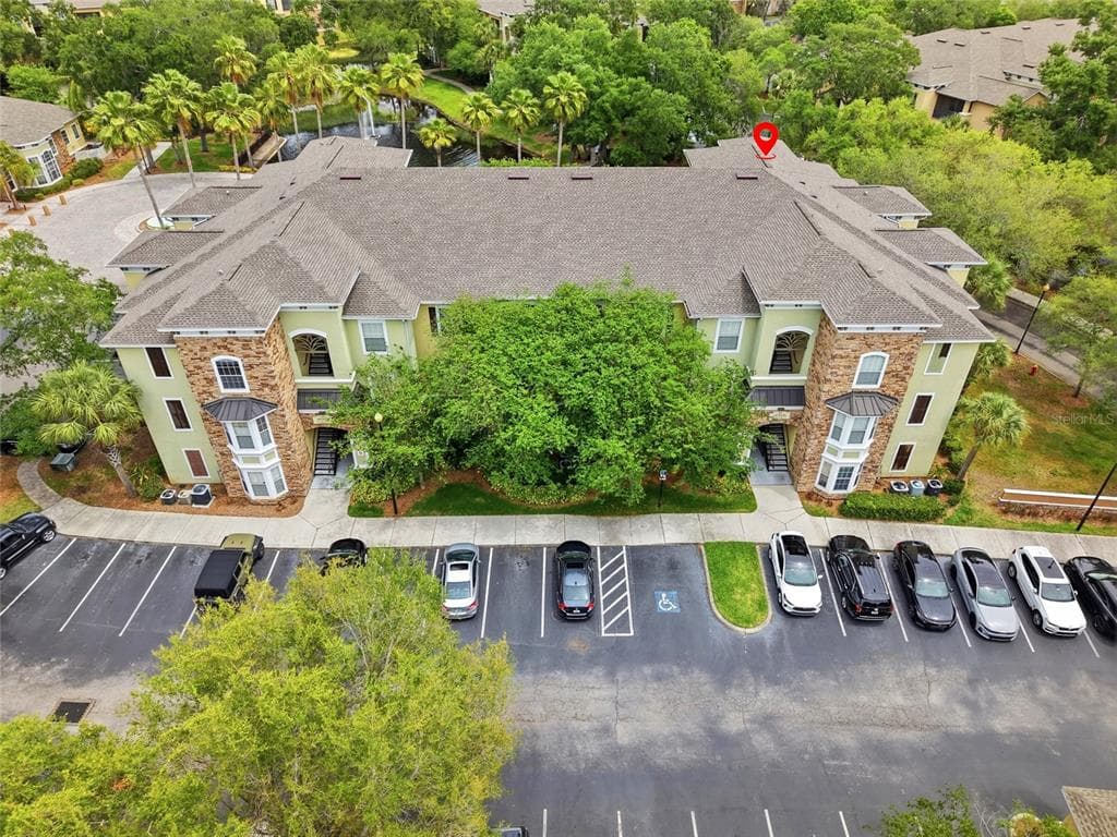 9916 COURTNEY PALMS BOULEVARD UNIT 302