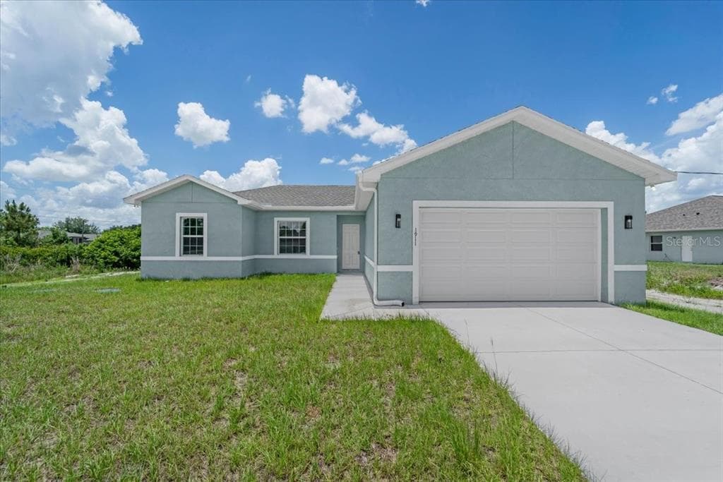 1911 RICHMOND AVENUE N LEHIGH ACRES, FL 33972
